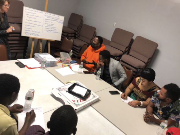 A group gathers for a listening session