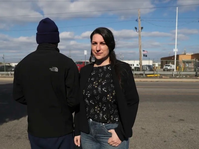 Lilah Thompson stands with Juan Carlos, who is pictured from behind